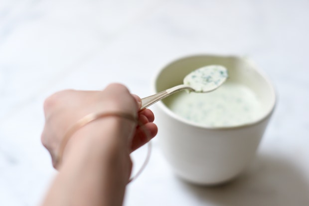 Lemon Coconut Sauce in a Serving Bowl with a Spoon