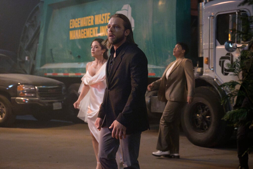 Gabriela and Bode walk outside the bar