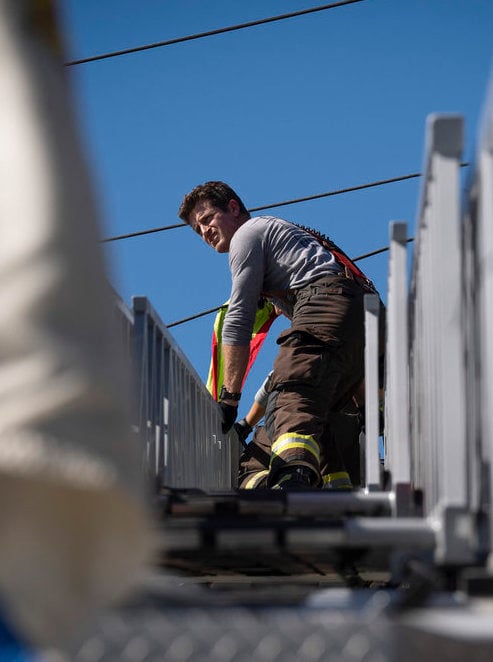 Carver works on the ladder.