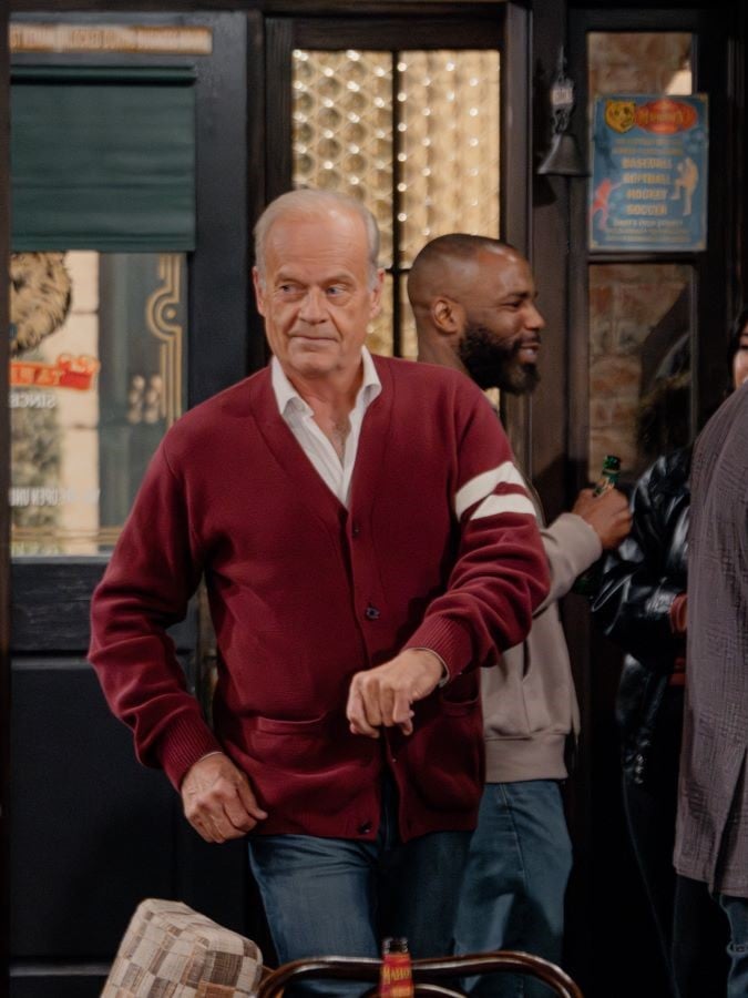 Frasier jauntily wears a Harvard caardigan