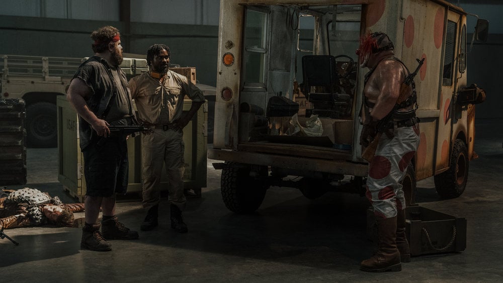 Stu, Mike, and Sweet tooth at a truck.