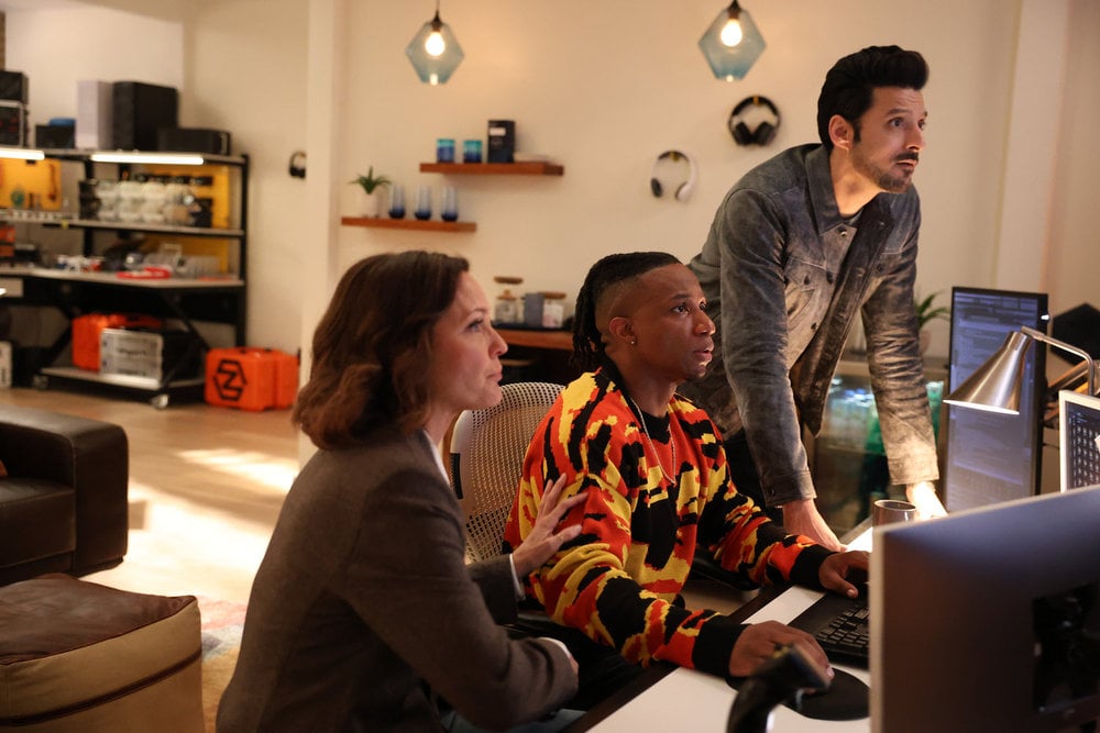 Zeke, Dhan, and Margaret focus on a clue.