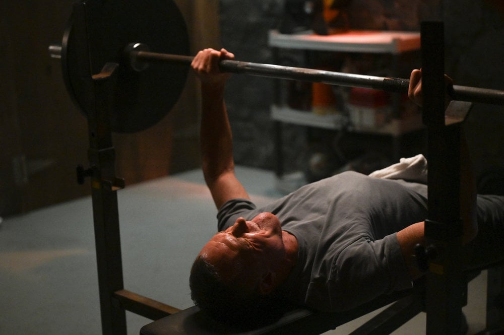 Voight lifts weights in his basement.