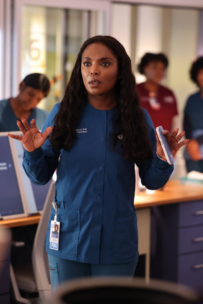 Maggie in her scrubs holding her phone on Chicago Med Season 10 Episode 5