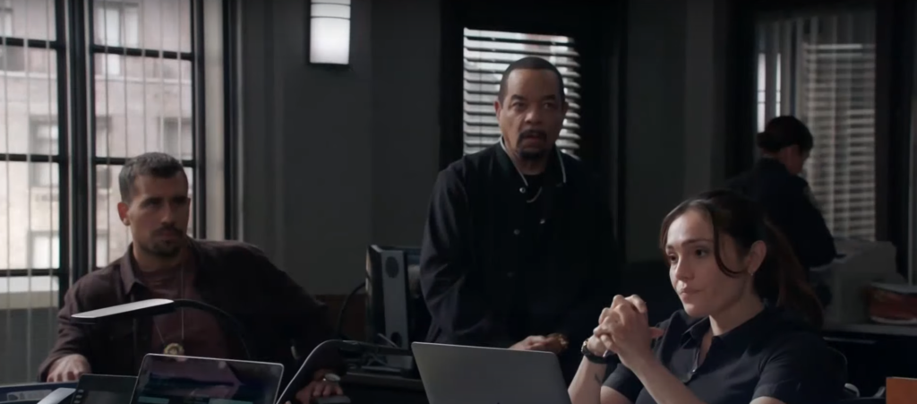 The crew examines evidence on a laptop on Law & Order: SVU Season 26 Episode 5