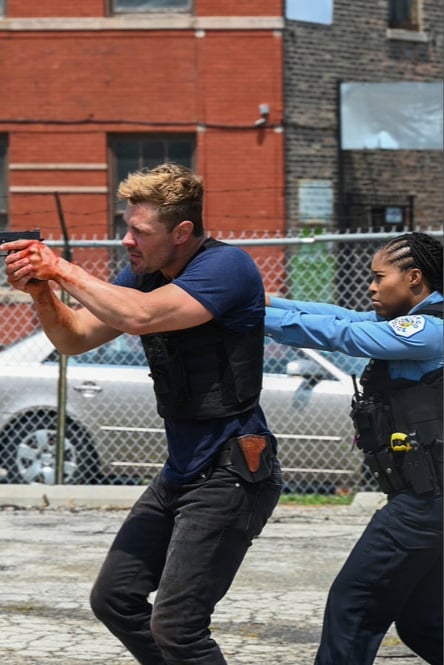 Ruzek and Cook have their guns drawn as they look into Martel's shooting.