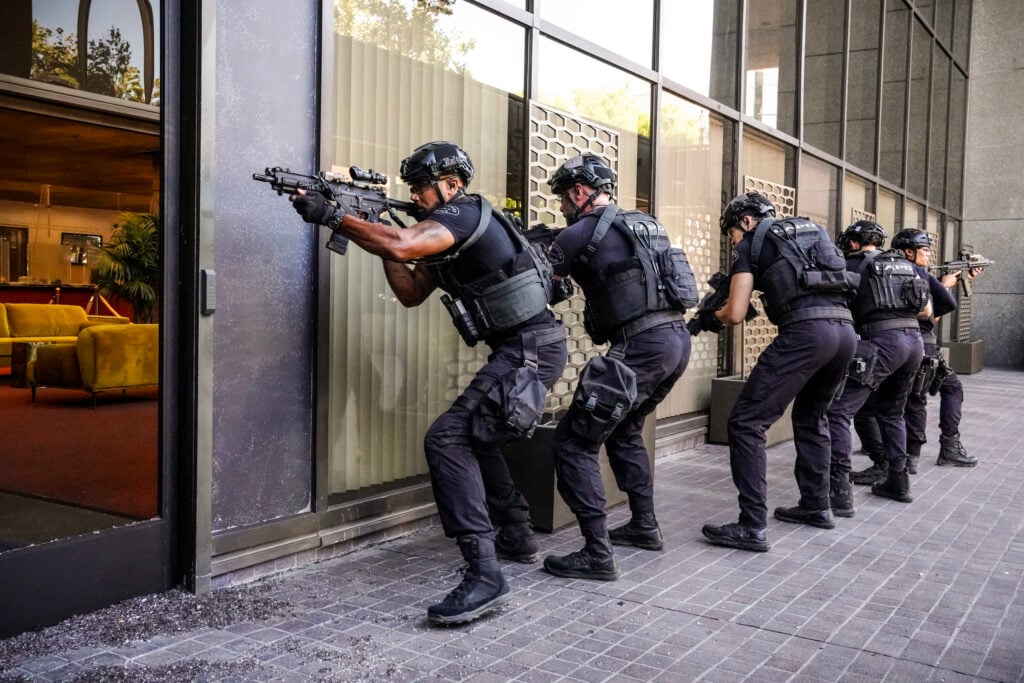 Twenty-David SWAT team preparing to enter