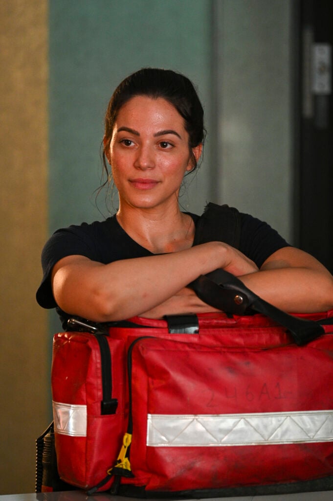 Gabriela leans on a medical bag