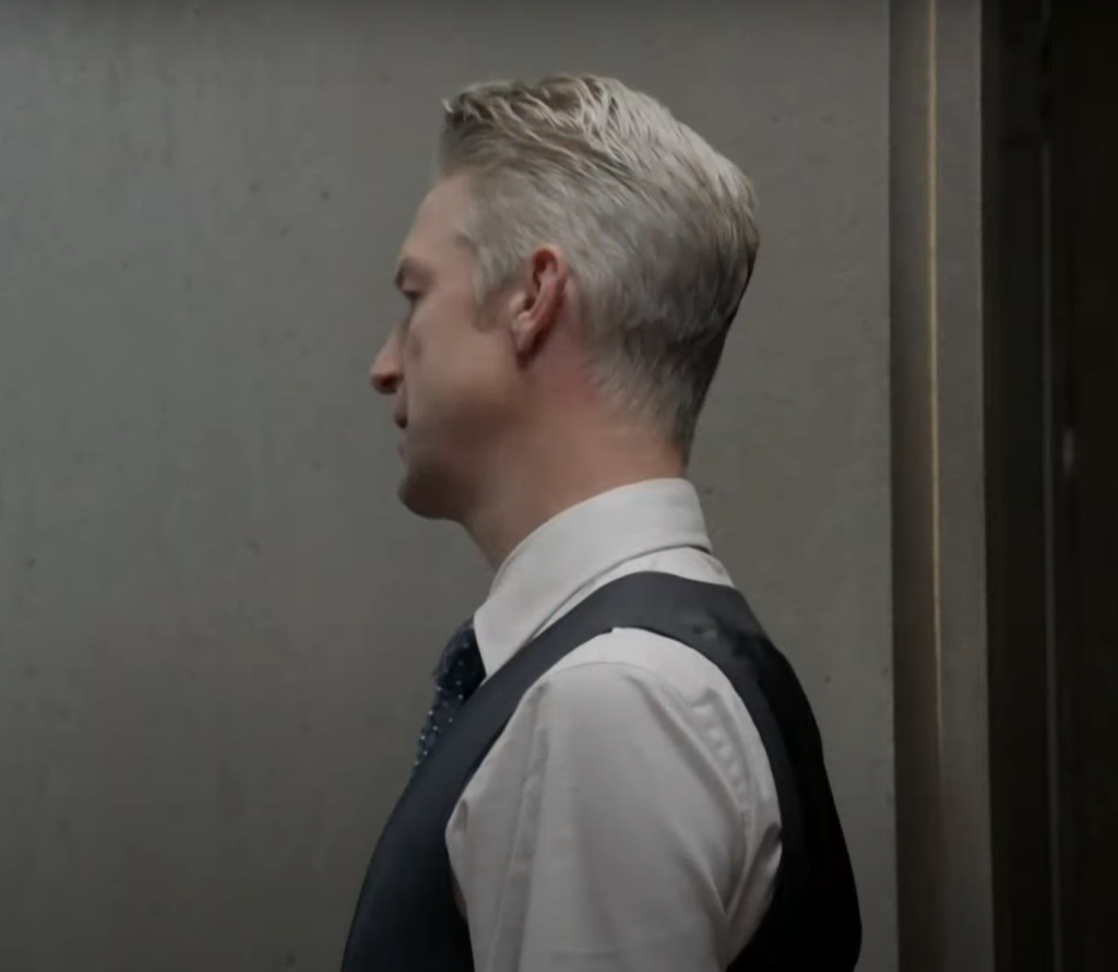 Carisi facing a wall and looking concerned on Law & Order: SVU Season 26 Episode 8