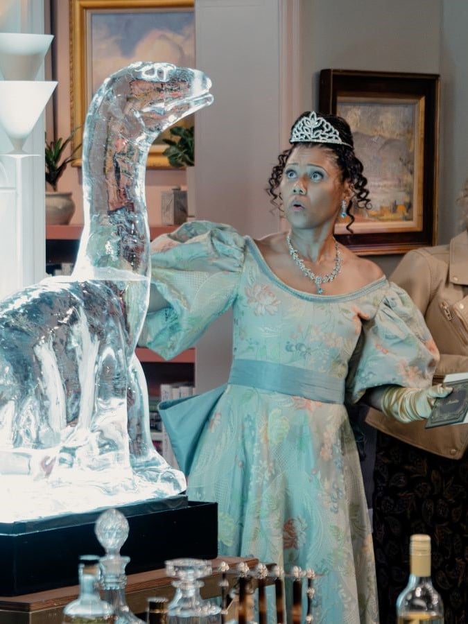 Olivia in Regency dress next to ice sculpture