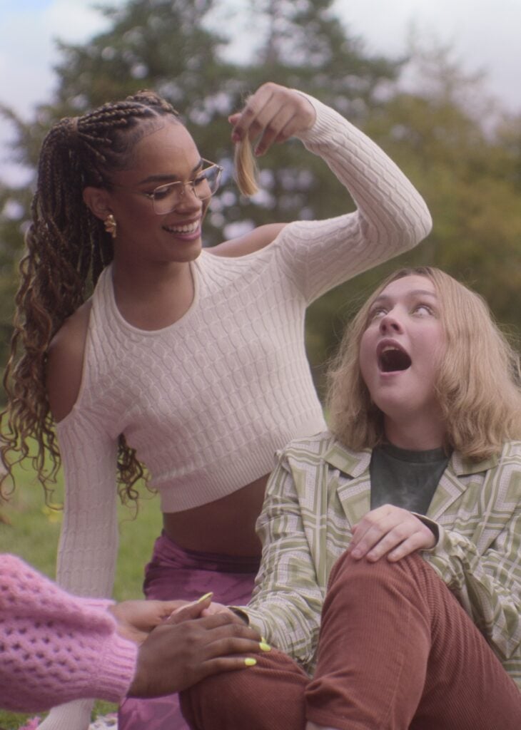 Elle and Darcy having fun outside on Heartstopper