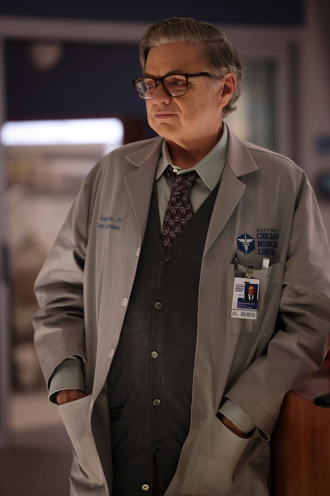 Dr. Charles standing with his hands in his coat pockets on Chicago Med Season 10 Episode 6