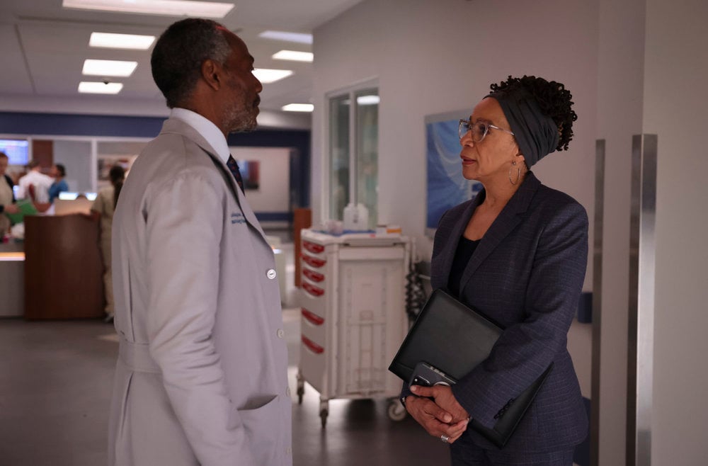 Washington standing and looking at Sharon on Chicago Med Season 10 Episode 6