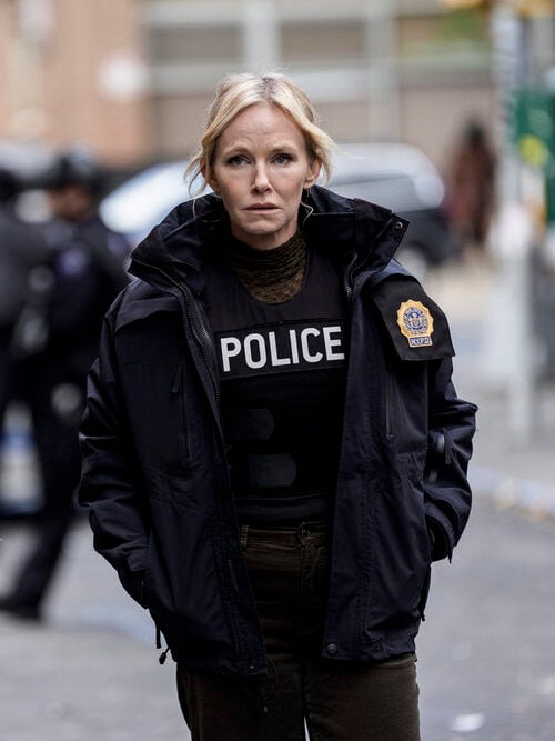 Rollins running toward the scene with some blurry cops behind her on Law & Order: SVU Season 26 Episode 8