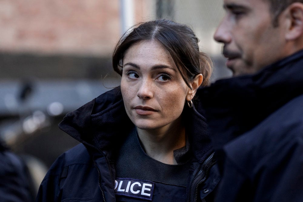 Silva wearing a police vest and looking at Velasco on Law & Order: SVU Season 26 Episode 8