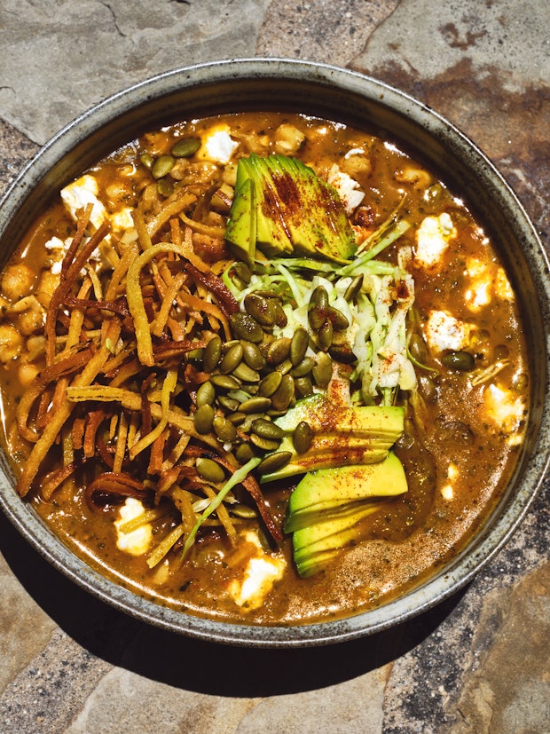 Vegan Red Pozole in a Bowl with lots of toppings