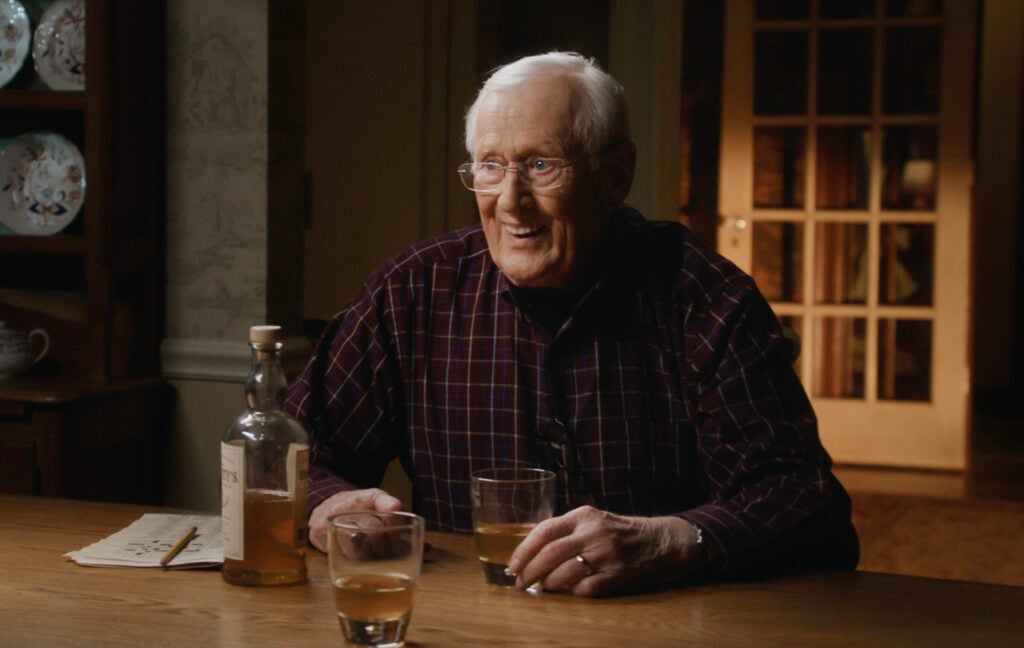 Henry smiling over a drink on Blue Bloods Season 14 Episode 17