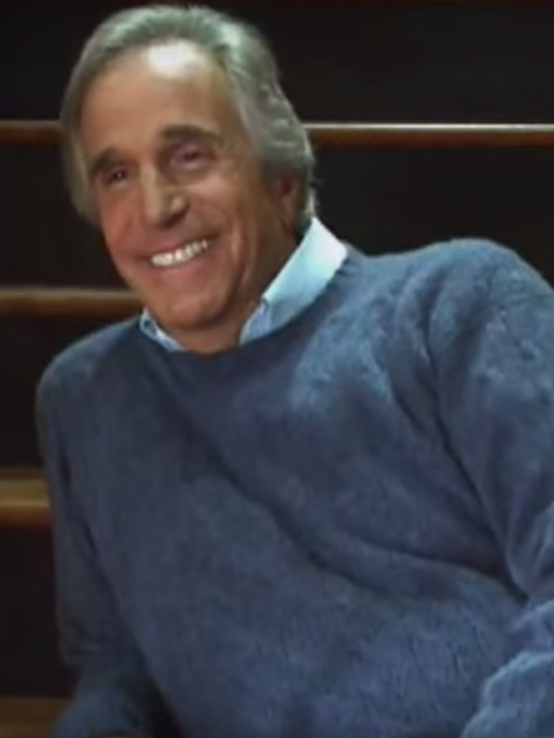 Henry Winkler wears a blue sweater and stars in Hallmark's The Most Wonderful Time of the Year