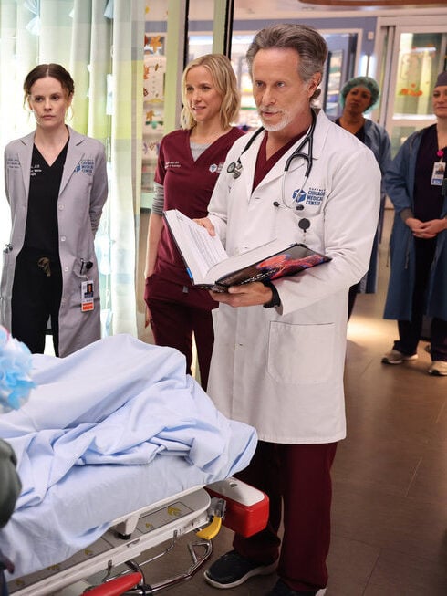 The crew gathers around a patient on Chicago Med Season 10 Episode 8