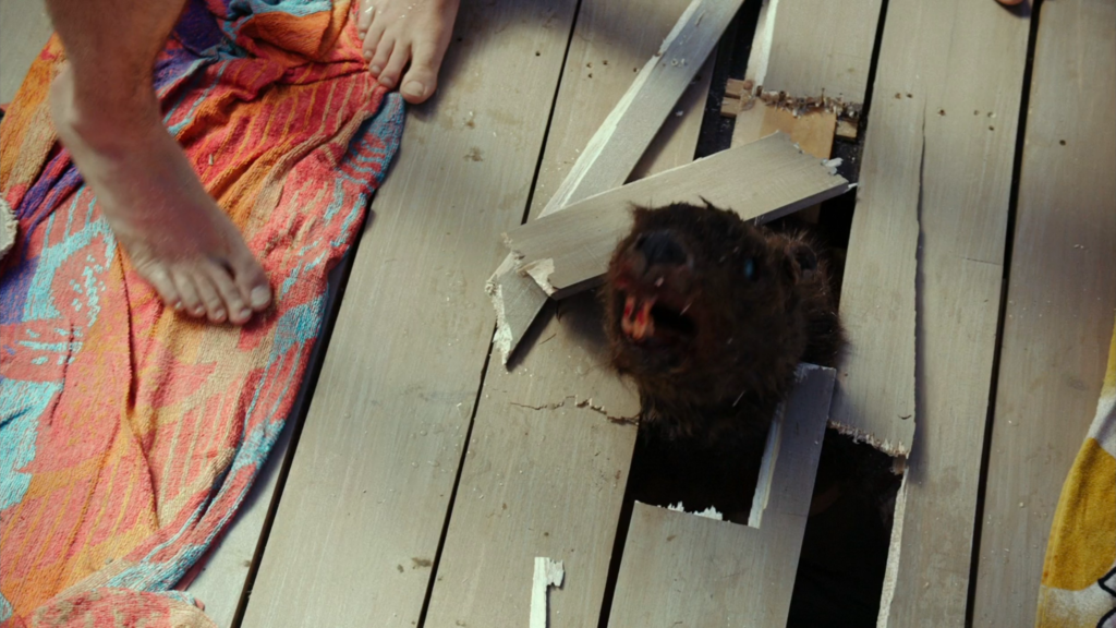 A zombie beaver bursts through the pier.