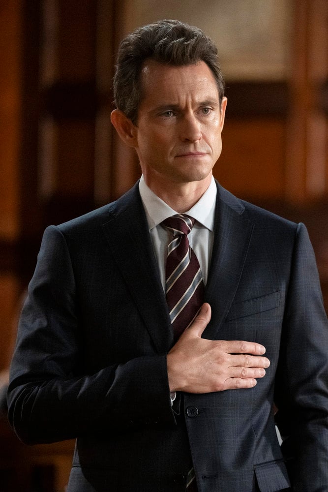 Price standing with his hand over his heart in court on Law & Order Season 24 Episode 2